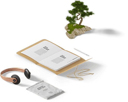 Caderno, planta e fone de ouvido